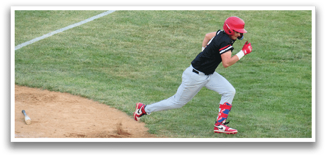 A baseball player running to first base. Description generated by AI
