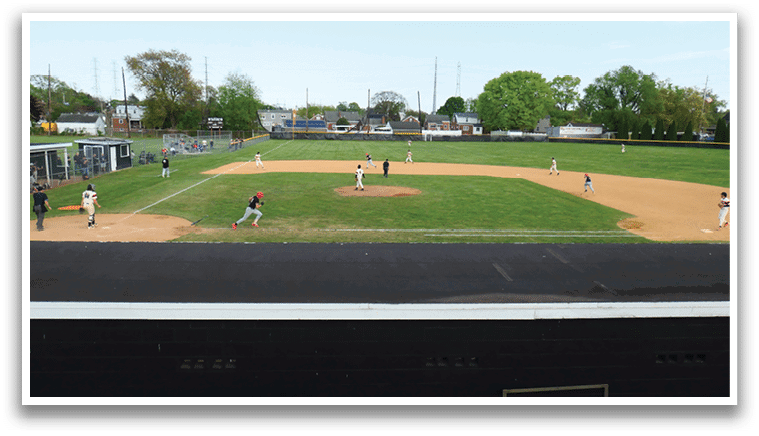 A baseball game is being played on a field. Description generated by AI