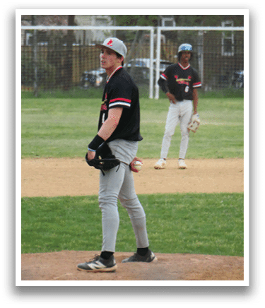 A baseball player standing on a mound. Description generated by AI