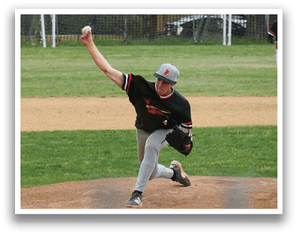 A baseball player in a black shirt and grey pants is pitching a ball. Description generated by AI