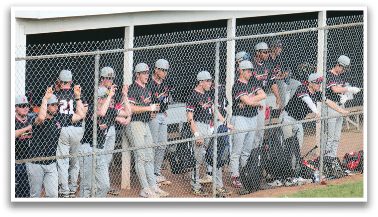 Baseball players in a dugout. Description generated by AI