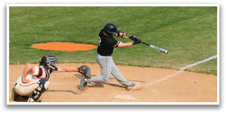 A baseball player is swinging a bat at a ball. Description generated by AI