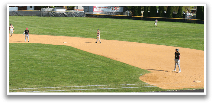 A baseball player slides into home plate. Description generated by AI