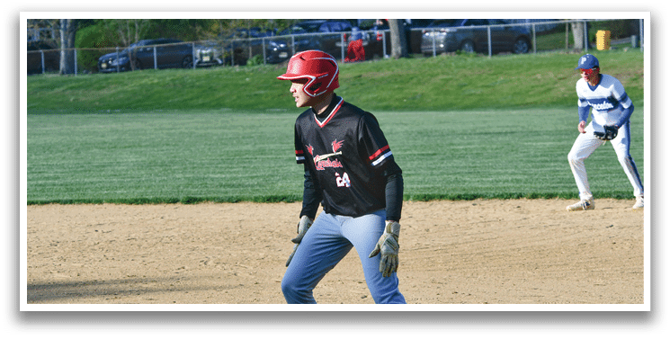 A baseball player wearing a red helmet and black shirt. Description generated by AI
