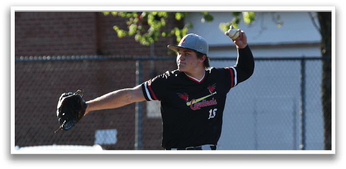 A baseball player in a black and red shirt and grey pants is pitching a ball. Description generated by AI