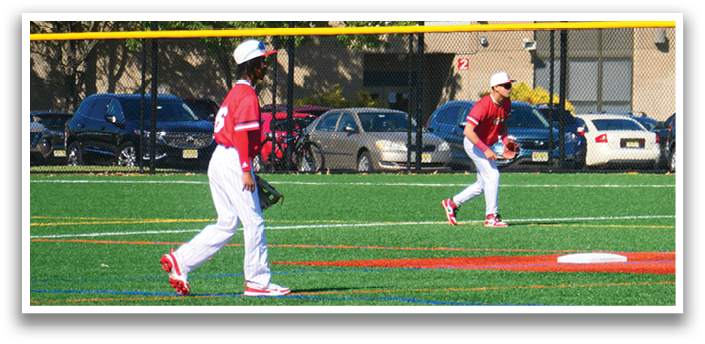 Two baseball players on a field. Description generated by AI