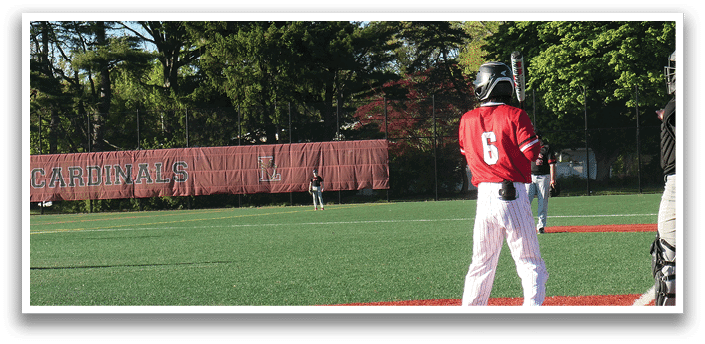 A baseball game is taking place on a field with a man standing at home plate. Description generated by AI