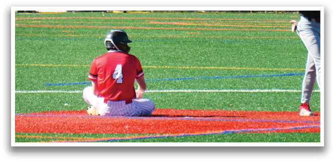 A baseball player is sitting on the ground with his glove on. Description generated by AI