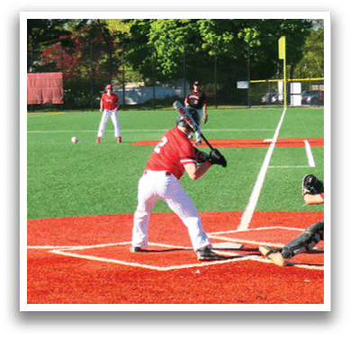 A baseball game is being played on a field. Description generated by AI