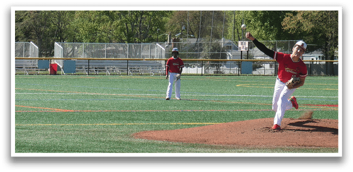 A baseball player is swinging a bat on a field. Description generated by AI