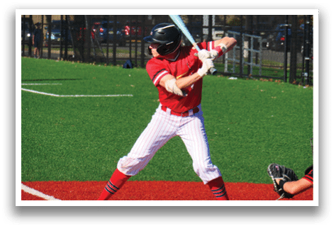 A baseball player in a red shirt and white pants is swinging a bat. Description generated by AI