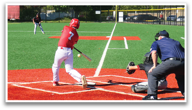 A baseball player is holding a bat and getting ready to swing. Description generated by AI