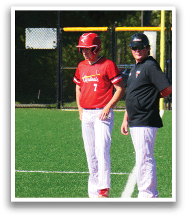 Two baseball players standing on a field. Description generated by AI