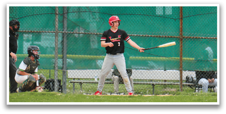 A baseball player is holding a bat and getting ready to swing. Description generated by AI