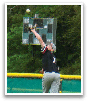 A baseball player catching a ball. Description generated by AI