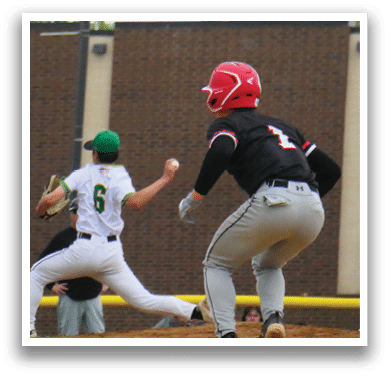 A baseball player in a green shirt and white pants is running to first base. Description generated by AI