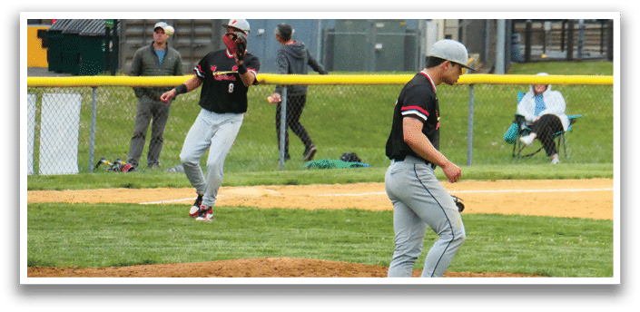 A baseball player is standing on the pitcher's mound. Description generated by AI