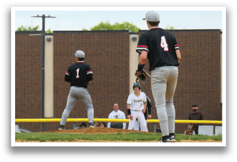 A baseball game is taking place on a field with a man in a black shirt and white pants standing in the outfield. Description generated by AI
