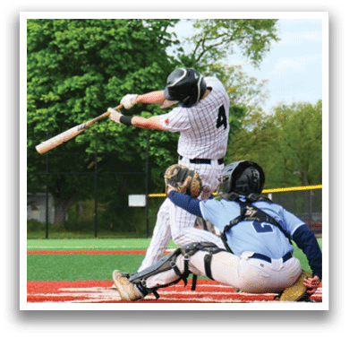 A baseball player is swinging a bat at a ball. Description generated by AI