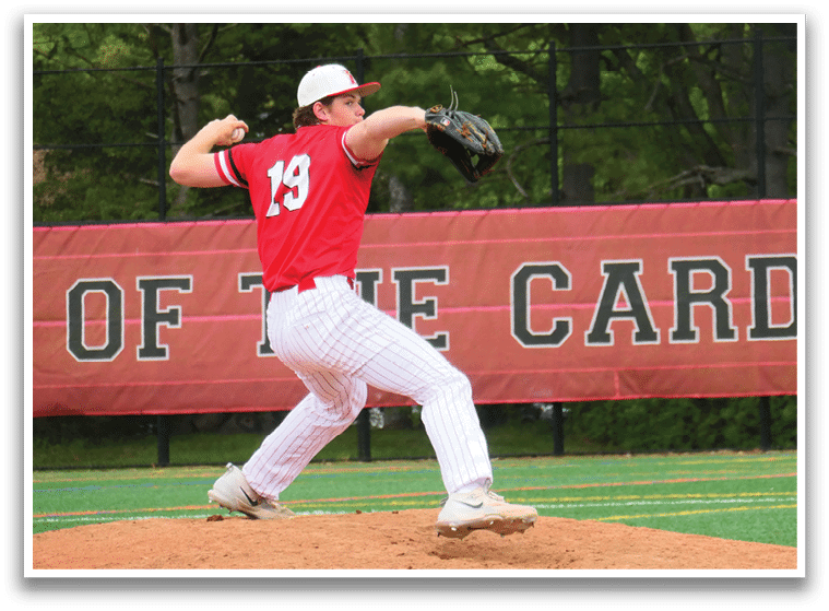 A baseball player in a red shirt and white pants is pitching a ball. Description generated by AI