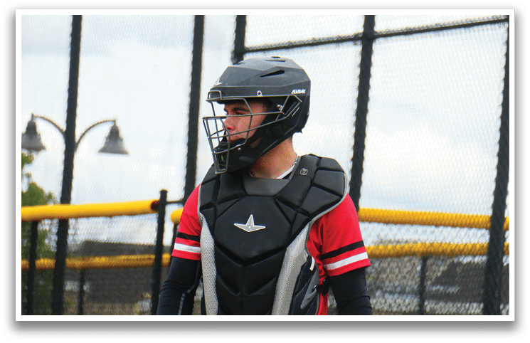 A man wearing a helmet and a chest protector. Description generated by AI
