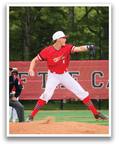 A baseball player in a red shirt and white hat is pitching a ball. Description generated by AI