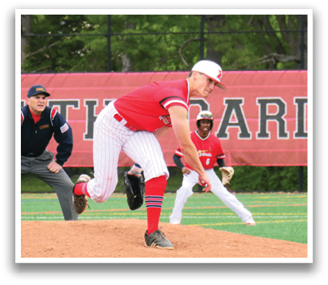 A baseball player in a red shirt and white hat is pitching a ball. Description generated by AI