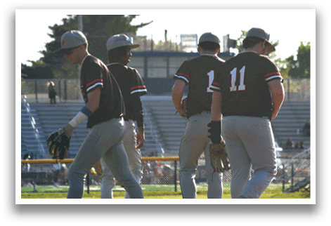 Baseball players walking on a field. Description generated by AI