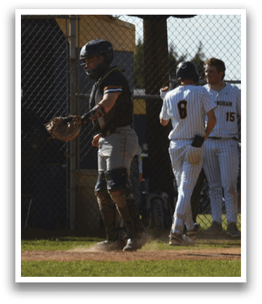 A baseball player wearing a black helmet and catcher's mitt. Description generated by AI