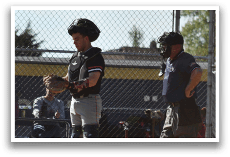 A baseball player with a catcher's mitt on his left hand. Description generated by AI