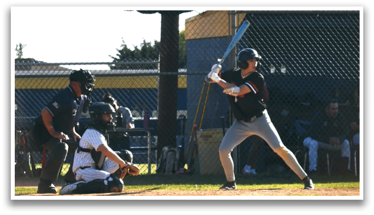 A group of baseball players wearing black and white uniforms. Description generated by AI