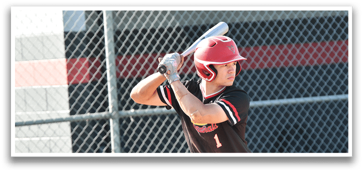 A baseball player in a black and white shirt is swinging a bat. Description generated by AI