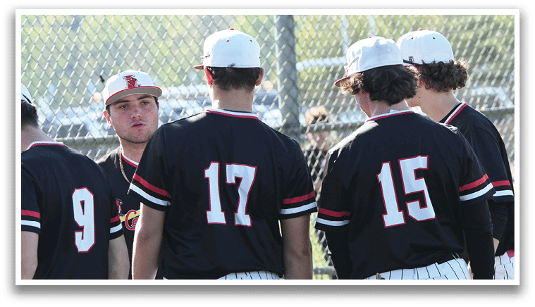 Baseball players wearing black and white uniforms. Description generated by AI