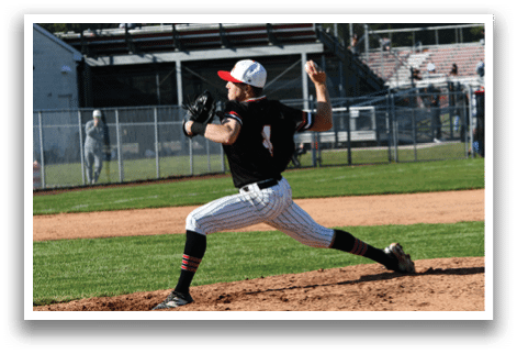 A baseball player in a black shirt and red hat is pitching a ball. Description generated by AI