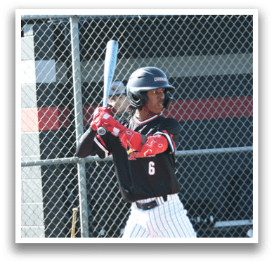 A baseball player in a black and white uniform is swinging a bat. Description generated by AI