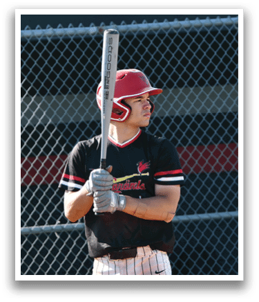 A baseball player holding a bat. Description generated by AI