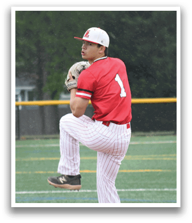 A baseball player in a red shirt and white pants is pitching a ball. Description generated by AI