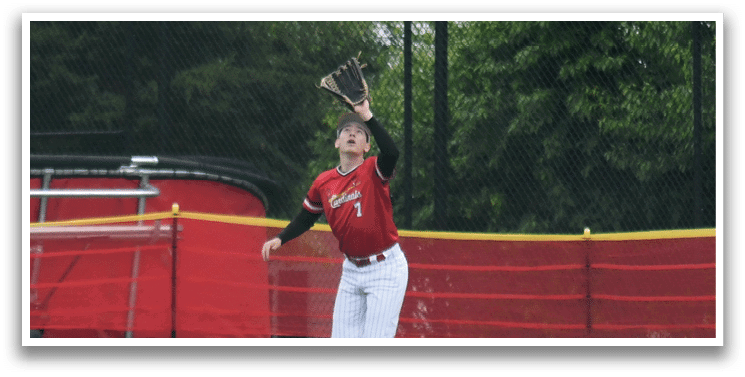 A person is playing baseball on a field. Description generated by AI