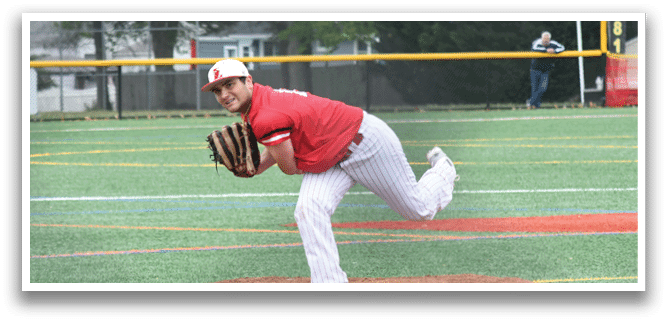 A baseball player in a red shirt and white pants is throwing a ball. Description generated by AI