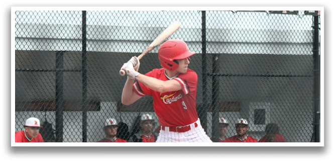 A baseball player in a red shirt and white pants is swinging a bat. Description generated by AI
