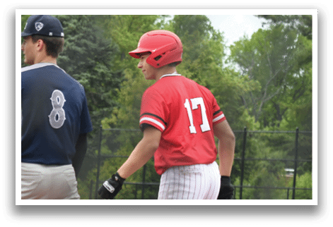 Two baseball players walking on a field. Description generated by AI