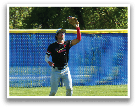 A baseball player catching a ball. Description generated by AI