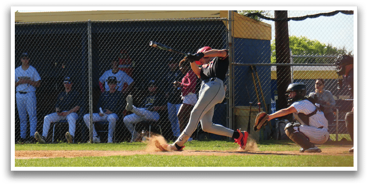 A baseball player is swinging a bat at a ball. Description generated by AI
