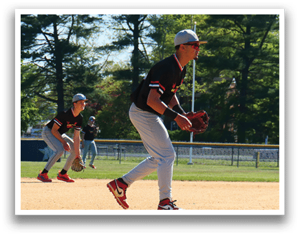 A baseball player catching a ball. Description generated by AI