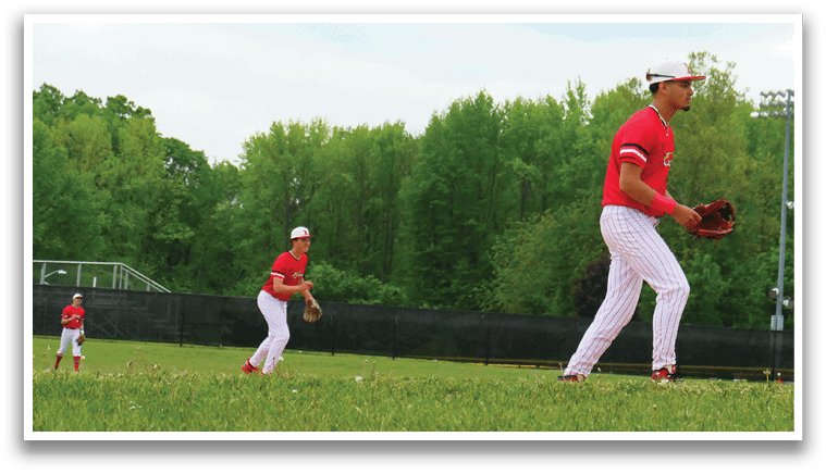 Two baseball players on a field. Description generated by AI
