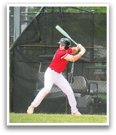 A baseball player in a red shirt and white pants is swinging a bat. Description generated by AI