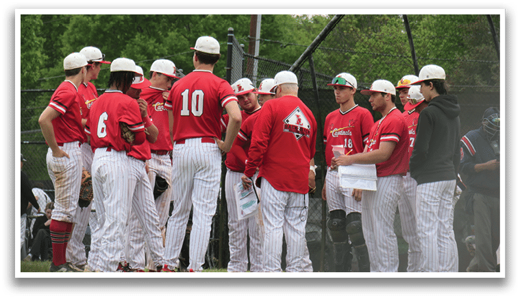 A group of baseball players wearing red shirts and white pants. Description generated by AI