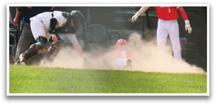 A baseball player slides into a base. Description generated by AI