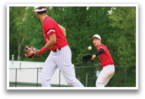Two baseball players on a field. Description generated by AI