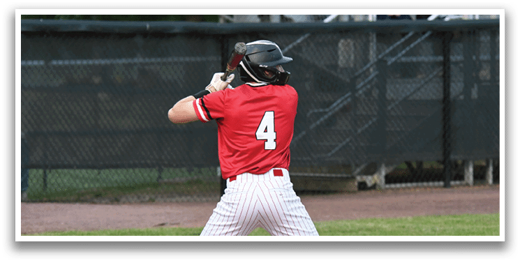 A baseball player in a red and white uniform is swinging a bat. Description generated by AI